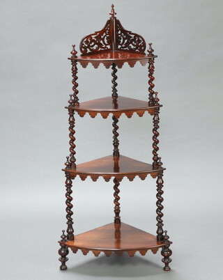 A Victorian rosewood graduated 4 tier corner what-not, the back with pierced gallery, raised on spiral turned supports 130cm h x 59cm w x 40cm d 