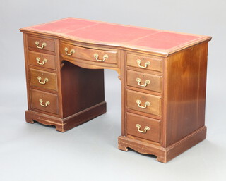 An Edwardian mahogany kneehole pedestal desk with red inset writing surface above 1 long and 8 short drawers with brass swan neck drop handles, raised on bracket feet 80cm h x 137cm w x 62cm d 