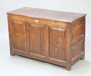 A 17th/18th Century oak coffer of panelled construction with hinged lid and brass lock plate 76cm  h x 118cm w x 51cm d 