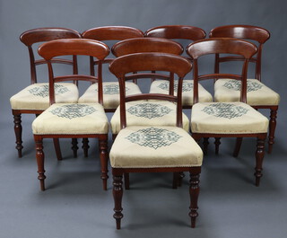 A set of 8 19th Century mahogany bar back dining chairs with shaped mid rails and overstuffed seats 