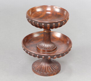 A Georgian style circular turned and fluted mahogany 2 tier table centrepiece raised on outswept support 37cm x 29cm 