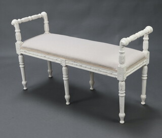 A 19th Century style white painted window seat with over stuffed seat, raised on 6 turned supports 63cm h x 109cm w x 41cm d 