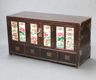 A Chinese hardwood cabinet, fitted shelves enclosed by a pair of folding panelled doors set floral panelled tiles, the base with 4 short drawers 80cm h x 151cm w x 58cm d 