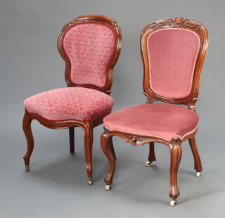 A 19th Century Continental carved walnut show frame dining chair, the seat and back upholstered in pink material, raised on cabriole supports 93cm x 50cm x 46cm  together with a similar chair 95cm x 49cm x 41cm 
