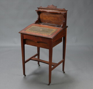 A Victorian inlaid rosewood Davenport with raised back, fitted a pen and 2 inkwell apertures, the base with later pine drawer, raised on square tapered supports with H framed stretcher 104cm h x 54cm w x 49cm d 