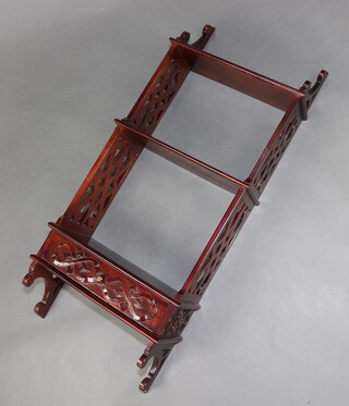 A Chippendale style mahogany 3 tier hanging wall shelf with pierced panels to the sides, blind fret work decoration to the drawer 98cm h x 40cm w x 19cm d 