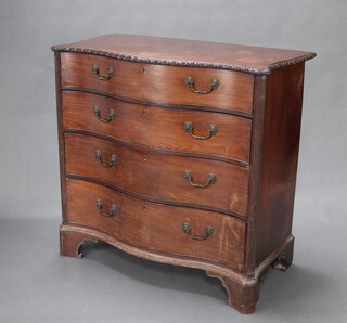 A Georgian mahogany chest of serpentine outline, gadrooned decoration and canted corners, fitted 4 drawers with brass swan neck drop handles and lion masks, raised on bracket feet 107cm h x 109cm w x 56cm d 