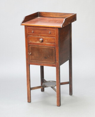 A 19th Century inlaid mahogany bedside cabinet with 3/4 gallery, base fitted a drawer above panelled door, having an X framed undertier 86cm h x 43cm w x 42cm d 