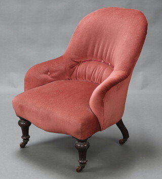 A Victorian tub back armchair with metal frame upholstered in pink buttoned material raised on turned and fluted supports 83cm h x 60cm w x 56cm d (seat 25cm x 32cm) 