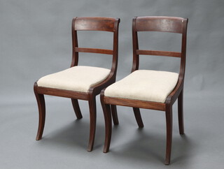 A pair of 19th Century mahogany bar back dining chairs with drop in seats, raised on sabre supports 82cm h x 46cm w x 46cm d (seats 25cm x 30cm) 