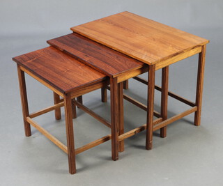 A mid-Century rosewood nest of 3 interfitting coffee tables, raised on square supports 46cm h x 59cm w x 38cm - Cites certificate reference No. 628778/01
