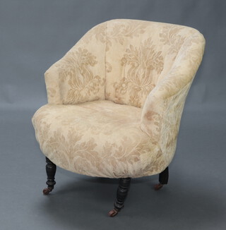 A Victorian tub back chair upholstered in yellow buttoned material, raised on turned supports 78cm h x 63cm w x 50cm d (seat 32cm x 37cm) 