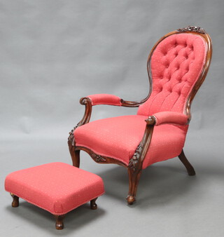 A Victorian carved mahogany show frame open armchair upholstered in red and gold buttoned material, raised on cabriole supports 94cm h x 60cm w x 54cm d (seat 30cm x 33cm), together with an associated later stool on cabriole supports 18cm h x 45cm w x 36cm d  