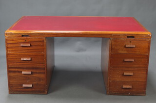 Waring and Gillow, an Art Deco mahogany desk with red inset writing surface fitted a brushing slide above 7 drawers, 72cm h x 153cm w x 91cm d 