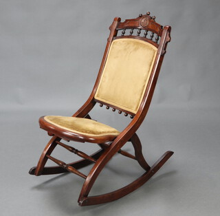 A 19th Century mahogany folding rocking chair with bobbin turned decoration 87cm h x 74cm w x 40cm d 