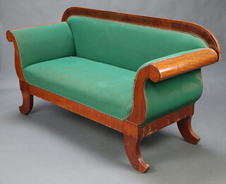 A Biedermeier style inlaid mahogany show frame sofa upholstered in green material, raised on outswept supports 95cm h x 179cm w x 66cm d (seat 120cm x 50cm) 