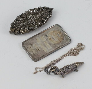 A marcasite Art Deco brooch/2 clips, a silver 1oz ingot and an articulated crocodile pendant 