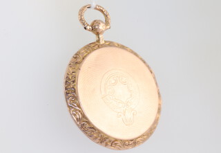 A 9ct yellow gold engine turned locket 36mm, 12.9 grams gross 
