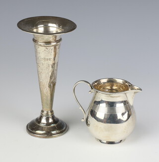 A Georgian style silver cream jug Birmingham 1929 and a silver tapered weighted posy vase 80 grams 