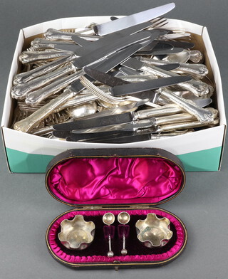 A quantity of silver plated cutlery and a cased plated cruet 