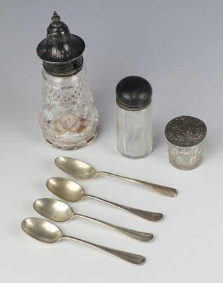 A silver mounted glass sugar shaker Birmingham 1913, 2 bottles, a silver spoon, 3 plated spoons, weighable silver 56 grams 