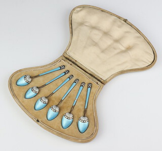 A set of 6 Continental silver and blue and white guilloche enamel coffee spoons in a fitted case 