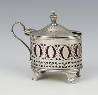 A Victorian silver oval pierced mustard pot with cranberry glass liner, Sheffield 1880, 54 grams 