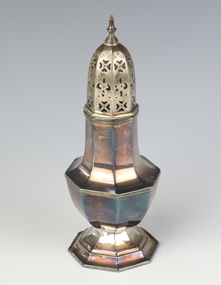 A silver octagonal sugar shaker of Queen Anne design, 158 grams, 21cm, rubbed marks