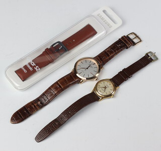 A gentleman's vintage gilt cased Tramway watch, 1 other and a watch strap 