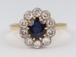 A 18ct yellow gold sapphire and diamond cluster ring, 3.9 grams, size S 