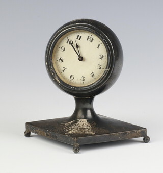 A circular silver table top timepiece on a triangular base with bun feet, Birmingham 1929, 11cm 