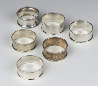 A Victorian silver napkin ring Chester 1897 and 5 others 