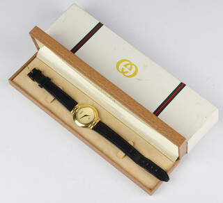 A gentleman's gilt cased Gucci wristwatch, quartz movement, boxed 