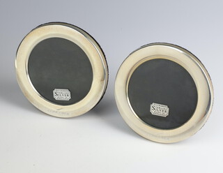 Two commemorative Concord circular sterling silver photograph frames  