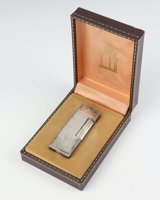 A gentleman's Dunhill silver plated engine turned gas cigarette lighter with engraved monogram, boxed 