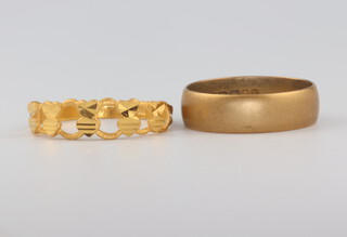 A 22ct gold yellow gold wedding band size J 1/2 3.9 grams and a yellow metal ring, size J, 2 grams 