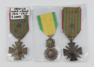 A French military medal and 2 Croix de Guerres  