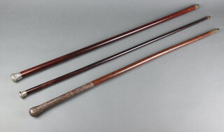 A hardwood silver wire work walking cane together with 2 silver mounted walking canes