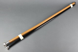 An ebonised walking cane with silver handle, another 