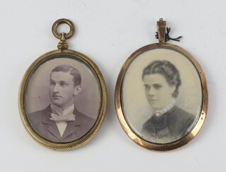 Two gilt oval frames containing portrait photographs 