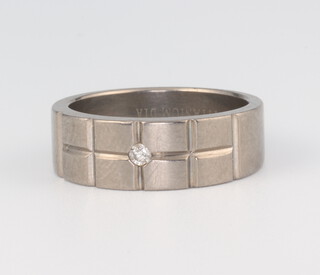 A Titanium diamond set wedding band, 3 grams, size P 