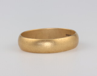 An 18ct yellow gold wedding band size W 1/2, 6.8 grams 