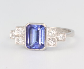 A yellow metal oval tanzanite and diamond cluster ring, the centre stone 0.25ct, the brilliant cut diamonds 1.5ct, 4.2 grams, size M 1/2