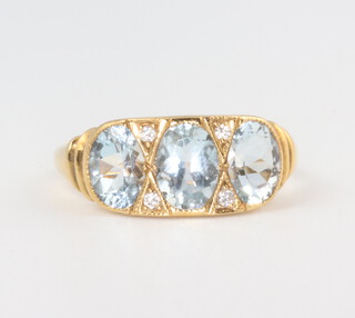 A yellow metal 15ct Victorian style aquamarine and diamond ring, the aquamarine 2.20ct, the brilliant cut diamonds 0.06ct, size L 1/2, 3.5grams 