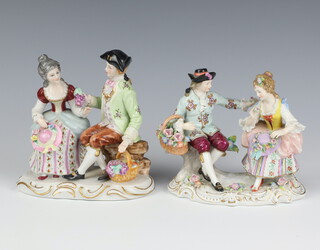 A 20th Century Thuringian porcelain group of a lady and gentleman, raised on a Rococo base 15cm, a similar ditto 15cm 