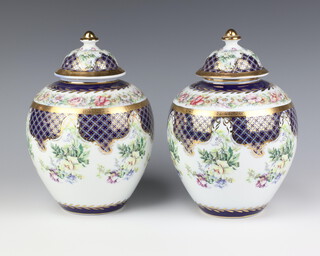 A pair of Roselle baluster vases and covers decorated with flowers 24cm 