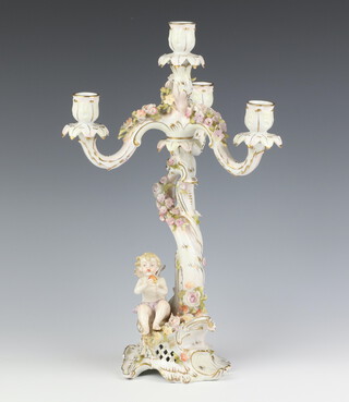 A 20th Century German porcelain candelabrum with 3 lights, the base with a seated cherub, applied with flowers 35cm 