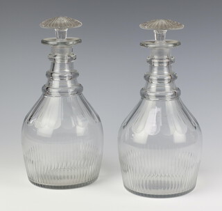 A pair of 19th Century faceted mallet shaped decanters with mushroom stoppers, 25cm 