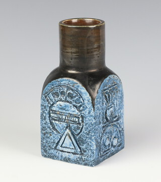 A Troika rough textured spice jar decorated motifs, circa 1975 by Simone Kilburn, finished in gloss brown and blue, 14.5cm