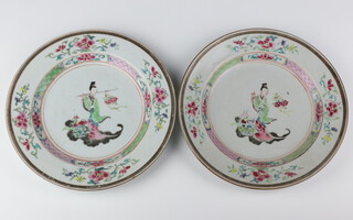 A pair of 18th Century Chinese famille rose plates decorated with a standing lady 23cm 